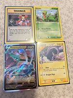 All four Pokémon cards laid out front side up