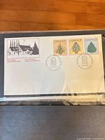 Full view of first day cover showing cachet, three stamps, and cancellations
