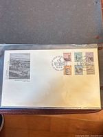 Full view of FDC in sleeve showing cachet, stamps, postmark