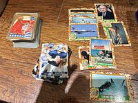 Stacks of basketball, football and Desert Storm cards on table
