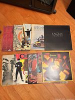 Full view of all 10 record jackets laid on floor