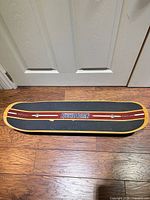 Top view of balance board showing grip surface, logo and graphics