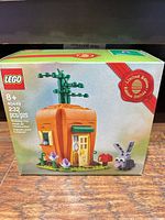 Front of LEGO 40449 box showing carrot house build, bunny figure, piece count, age rating