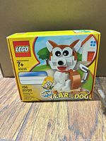Front of sealed LEGO 40235 box showing dog model, piece count and age rating