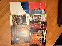 All eight LP covers spread on floor