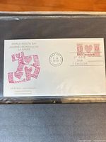 Full view of first day cover in protective sleeve