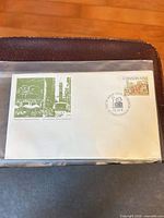 Full view of first day cover in sleeve showing stamp and cachet