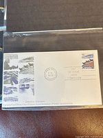 Front view of First Day Cover showing stamp, cachet artwork and bilingual Day of Issue text