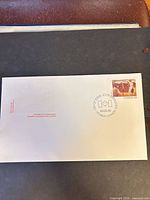 Full envelope front showing stamp, cancel, embossed maple leaf