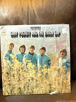 Front cover showing title, artist, shrinkwrap and price sticker