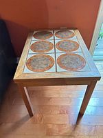 Full view of table showing wood frame and tile top