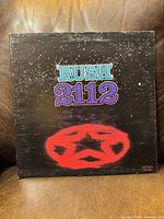 Front cover with Starman emblem and Rush 2112 title