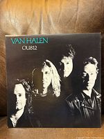 front cover with band portrait and album title