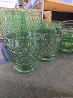Front view showing dessert bowls and tall glasses