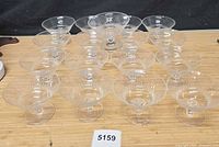 Group shot of all seventeen Rosenthal etched dessert cups arranged on table