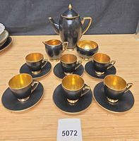 Full set laid out showing teapot, creamer, sugar bowl, six cups and six saucers
