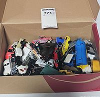 Top view of open box filled with assorted toy vehicles