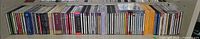 Shelf row of approx. 60 classical CDs, full width view