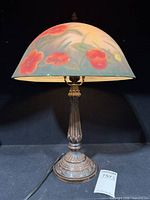 Full view of table lamp showing dome shade, base and power cord
