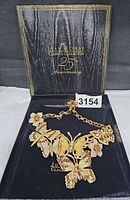 Necklace displayed in original 25th Anniversary box