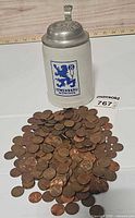 Stein and pile of pennies together