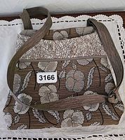 Front view of Maruca floral fabric handbag showing pattern, strap and scale