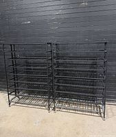 front view of two identical black metal wine racks
