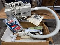 Oreck canister vacuum with hose, wands, floor head, attachments, instruction sheet and bag packs