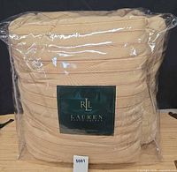 Front view of packaged Ralph Lauren Lauren comforter showing striped fabric and brand logo