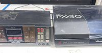 Front view of Aiwa RX-30 receiver beside Aiwa PX-30 turntable