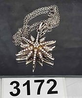 front view of sterling silver star pendant necklace with lot number visible