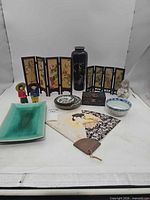 Full lot showing screens, vase, figurines, dishes, platter, fan and trivet