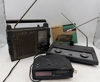 Group shot showing GE radio, Sony Dream Machine clock radio with box, Archer antenna