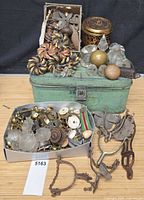 Entire lot showing bread box filled with assorted hardware and spurs