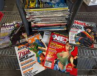 Front view of stack with four sample issues laid out showing game covers
