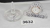 Ring holder and clock together showing scale and design