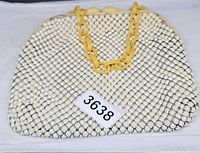 Front view of alumesh handbag with bakelite chain handle