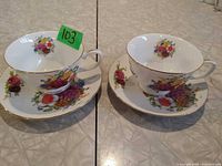 Front view showing both teacups and saucers