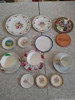 assorted plates and cups laid out on table