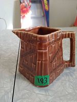 Front and side view of Bushmills ceramic jug