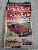 Front covers of all three Cars & Parts magazines stacked, top cover highlighting 1964 Pontiac GTO