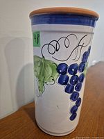 Side view showing grape and vine decoration