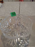 Top view of clear crystal candy dish showing interior starburst pattern and rim
