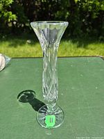 Full view of crystal bud vase standing upright