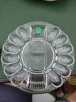 Top view showing full platter layout with egg wells and central compartment