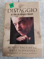 Front cover of hardcover book with title, authors, portrait of Joe DiMaggio