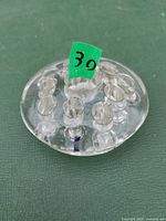 top view of clear glass flower frog showing ten holes