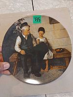 Front view of plate showing full Norman Rockwell illustration and edition number sticker