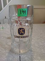 Front view showing Löwenbräu logo and dimple pattern