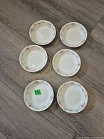 Top view of six matching bowls arranged on floor
